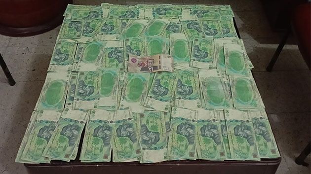 الإطاحة بوفاق إجرامي مختص في تدليس العملة التونسية