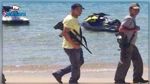 توضيح بخصوص صورة لعوني أمن مسلحيْن بزي مدني بأحد الشواطئ