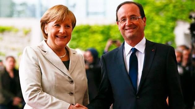 Merkel et Hollande bras-dessus bras-dessous à Stralsund