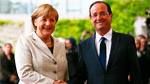 Merkel et Hollande bras-dessus bras-dessous à Stralsund