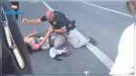 En vidéo : Arrestation musclée d'une militante pour s'être approchée du convoi du président américain